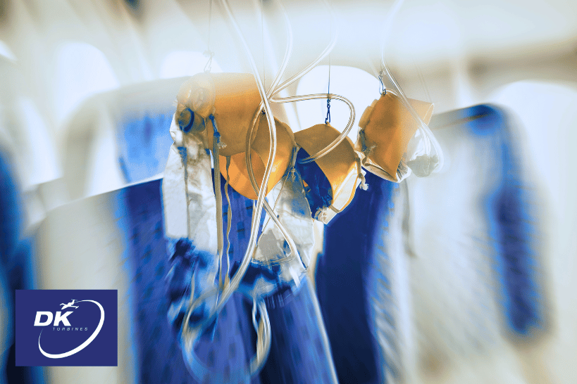 Oxygen masks hanging from airplane overhead compartments during decompression emergency